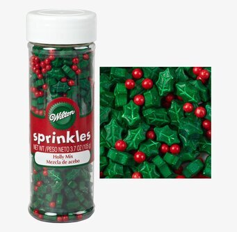 Bild av färgglatt julströssel i genomskinlig flaska