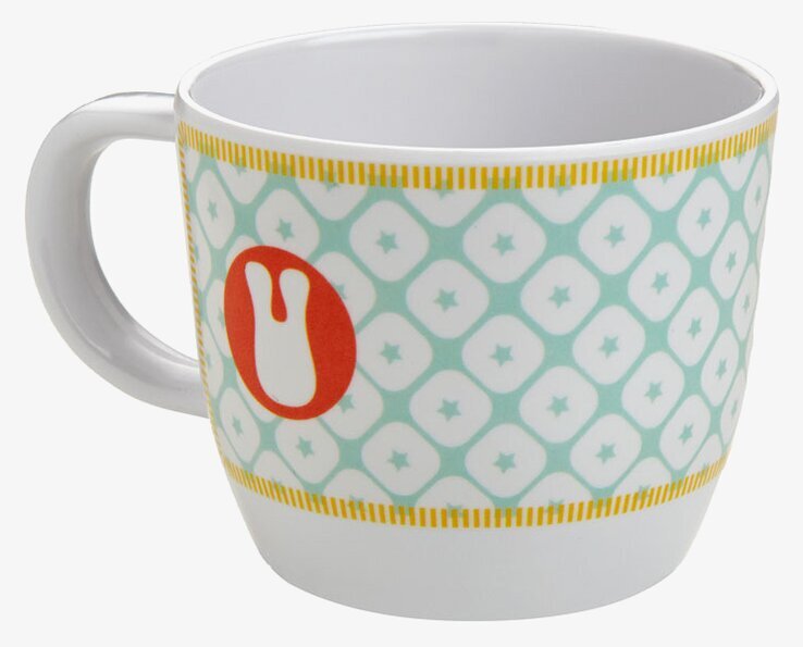 Foto av mugg med geometriskt mönster och färgdetaljer