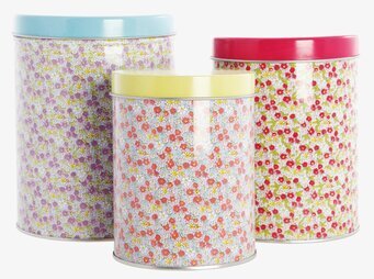 Bild av färgglada plåtburkar med blommiga mönster