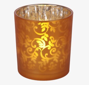 Foto av LED-vaxljus i glaskopp med dekorativa mönster