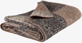 Bild av intrikat mönstrat täcke med klassisk design