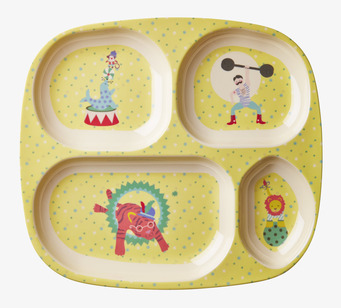 Bild av färgglad barntallrik med cirkustema i gult