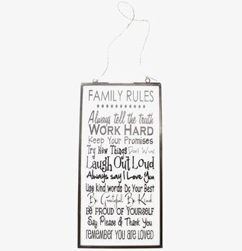 Bild av dekorativ tavla med inspirerande familjebudskap