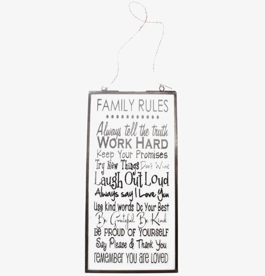 Bild av dekorativ tavla med inspirerande familjebudskap