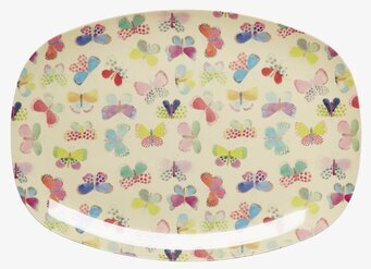 Bild av färgglad tallrik med fjärilsmotiv och elegans