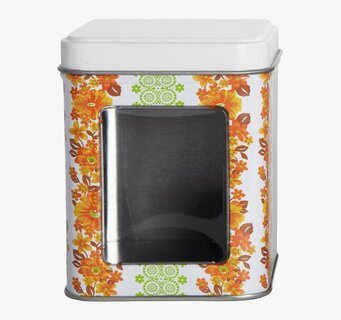 Bild av färgglad plåtburk med blommönster och fönster