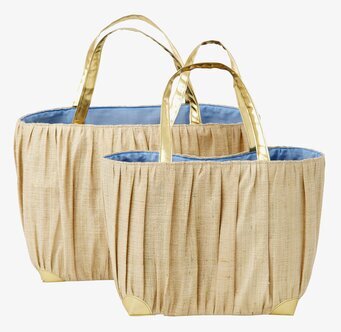 Bild av två väskor med guldhandtag och raffia-design