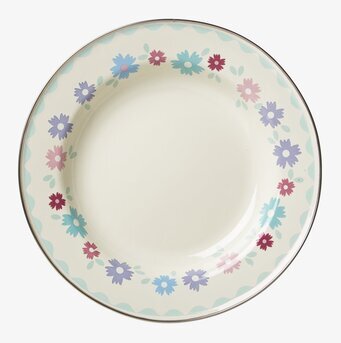 Bild av lunchtallrik med blommönster och krämfärgad bas