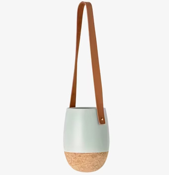 Foto av elegant hängande kruka i keramik och kork