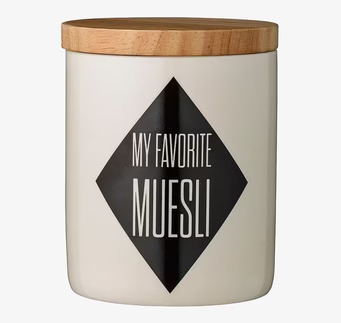 Bild av stilren porslinsburk med trälock i köket