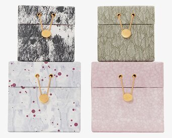 Bild av fyra dekorativa lådor med elegant design