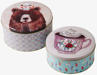 Bild av dekorativa plåtburkar med charmig design