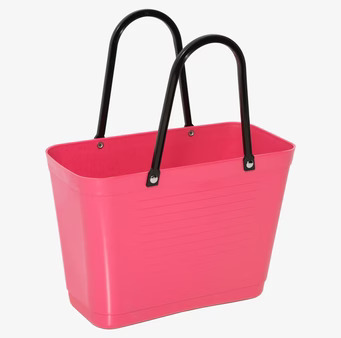 Bild av liten väska i tropikrosa med svarta handtag