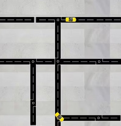 Bild av vägnät med svart tejp och gula leksaksbilar