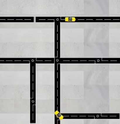 Bild av vägnät med svart tejp och gula leksaksbilar