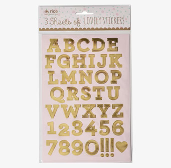 Bild av guldklistermärken: bokstäver, siffror, symboler