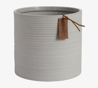 Bild av ljusgrå, minimalistisk kruka med läderdetalj