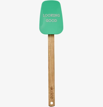 Bild av slickepott med grönt silikonhuvud och trähandtag