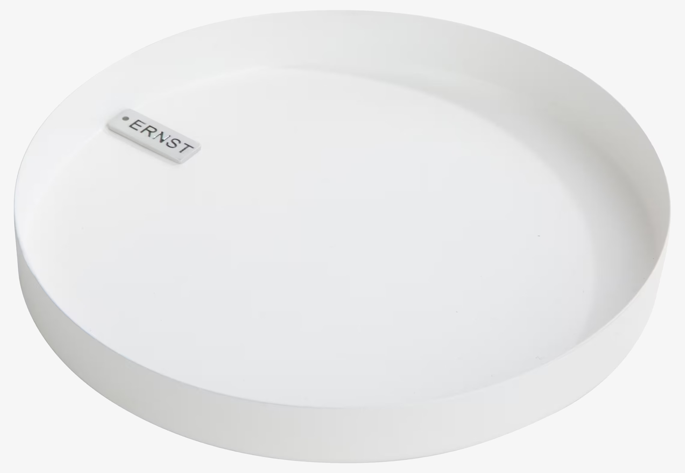 Bild av runt ljustråg i vit färg med stilren design