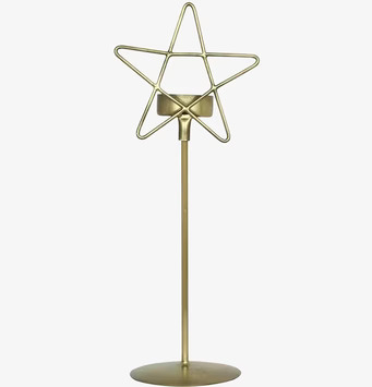 Bild av elegant ljusstake i antik mässing med stjärndesign