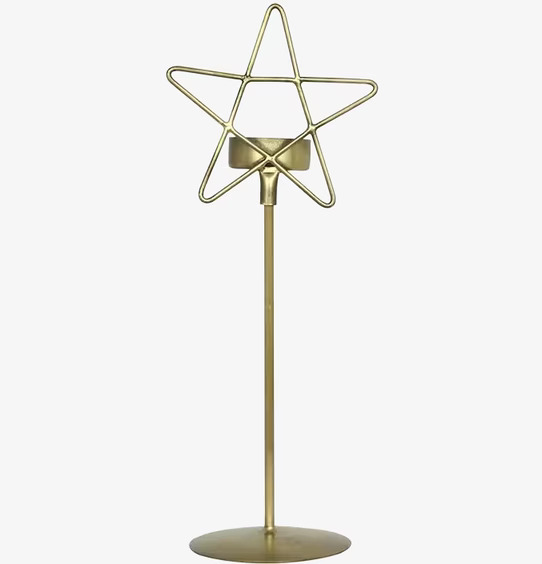 Bild av elegant ljusstake i antik mässing med stjärndesign