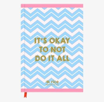 Bild av anteckningsbok med zickzackmönster och budskap