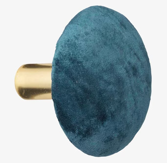 Foto av lyxig sammetknopp i petrol med gyllene bas
