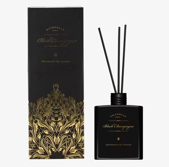 Foto av elegant doftpinnar i svart och guld design