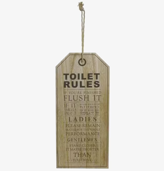 Bild av rustik tavla med humoristiska toalettregler