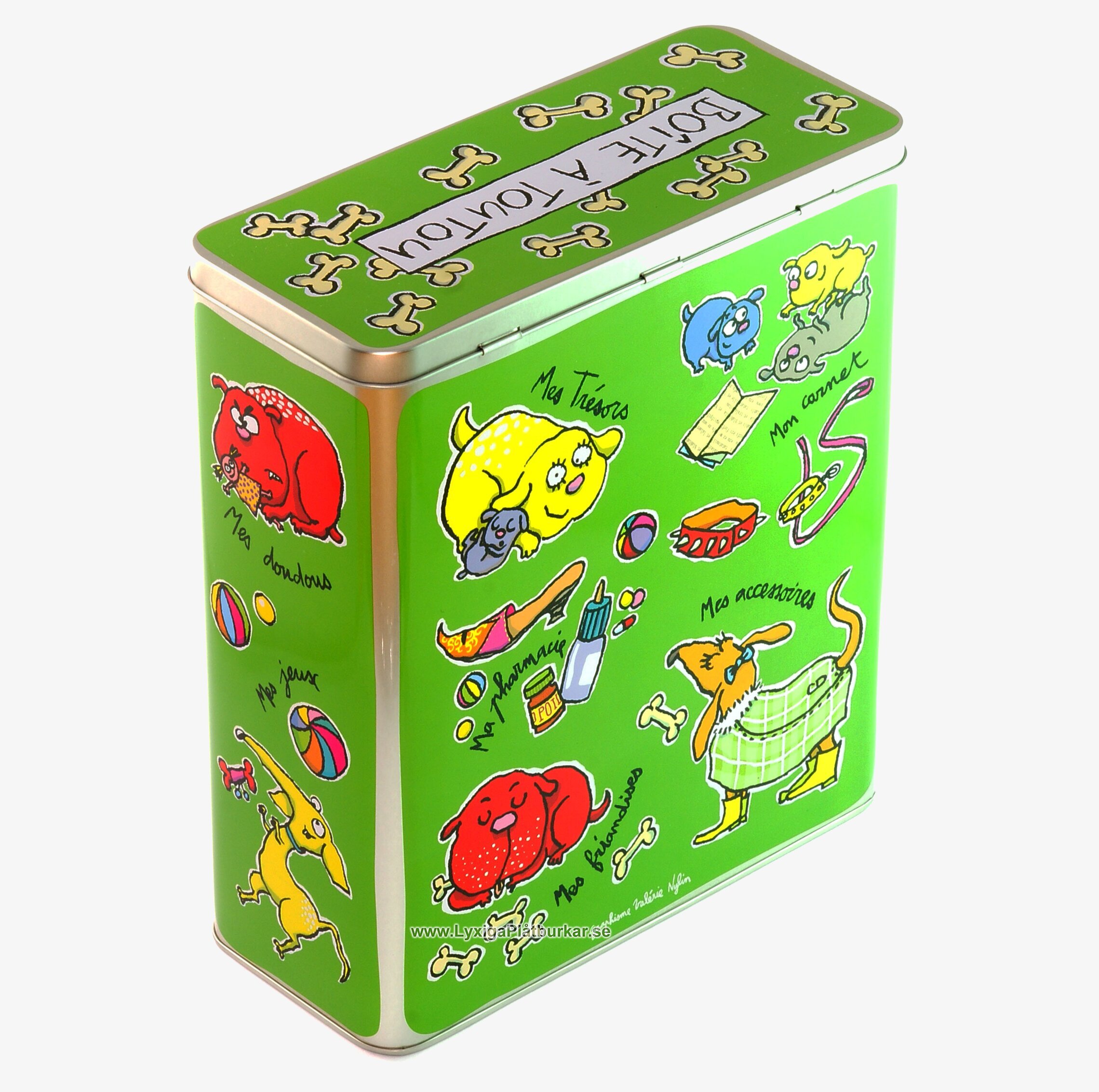 Foto av färgglad plåtburk med hundmotiv och fransk text