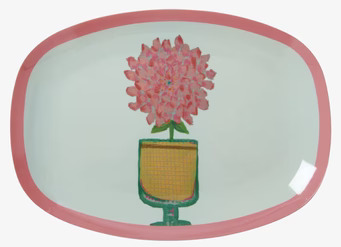 Bild av färgglad tallrik med blommotiv och rosa kant