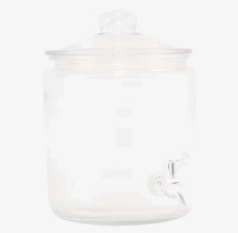 Bild av elegant glasburk med kran för servering