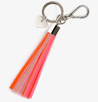 Bild av nyckelring med neonfärgade tofsar och reflex