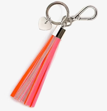 Bild av nyckelring med neonfärgade tofsar och reflex