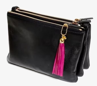 Foto: Stilren väska med gyllene detaljer och reflextofs