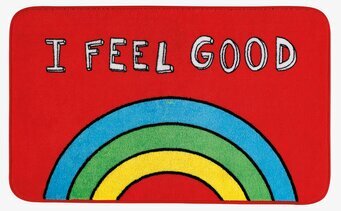 Bild av färgglad badrumsmatta med text och regnbåge