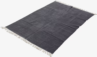 Bild av grå matta med subtil design och ljusa fransar