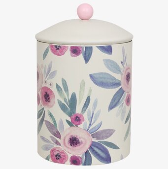 Foto av krämfärgad plåtburk med blommigt mönster