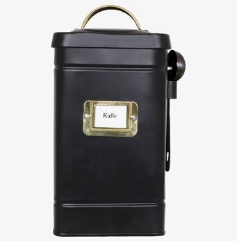 Bild av elegant svart och mässingsfärgad kaffeburk