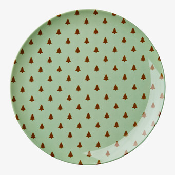 Bild av rund tallrik med grönt och brunt julmönster