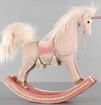 Bild av en magisk gunghäst i rosa och cremefärger