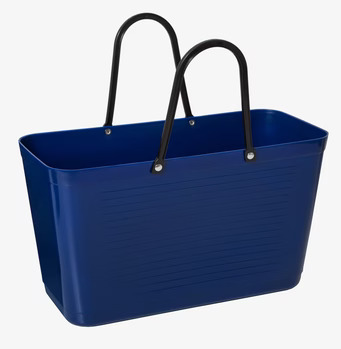 Bild av stilren och funktionell blå väska med detaljer