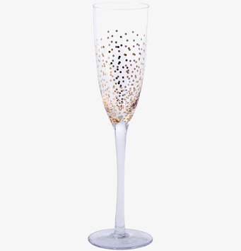 Bild av elegant champagneglas med guldprickig design