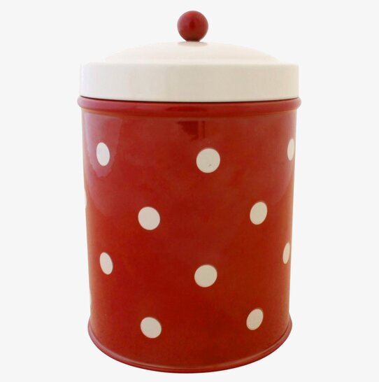 Bild av röd plåtburk med vita prickar och vit knopp