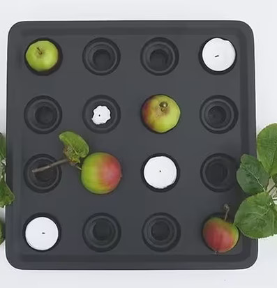 Bild av stilren ljushållare med naturliga inslag