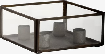 Foto av elegant adventsljusstake i glas och metall