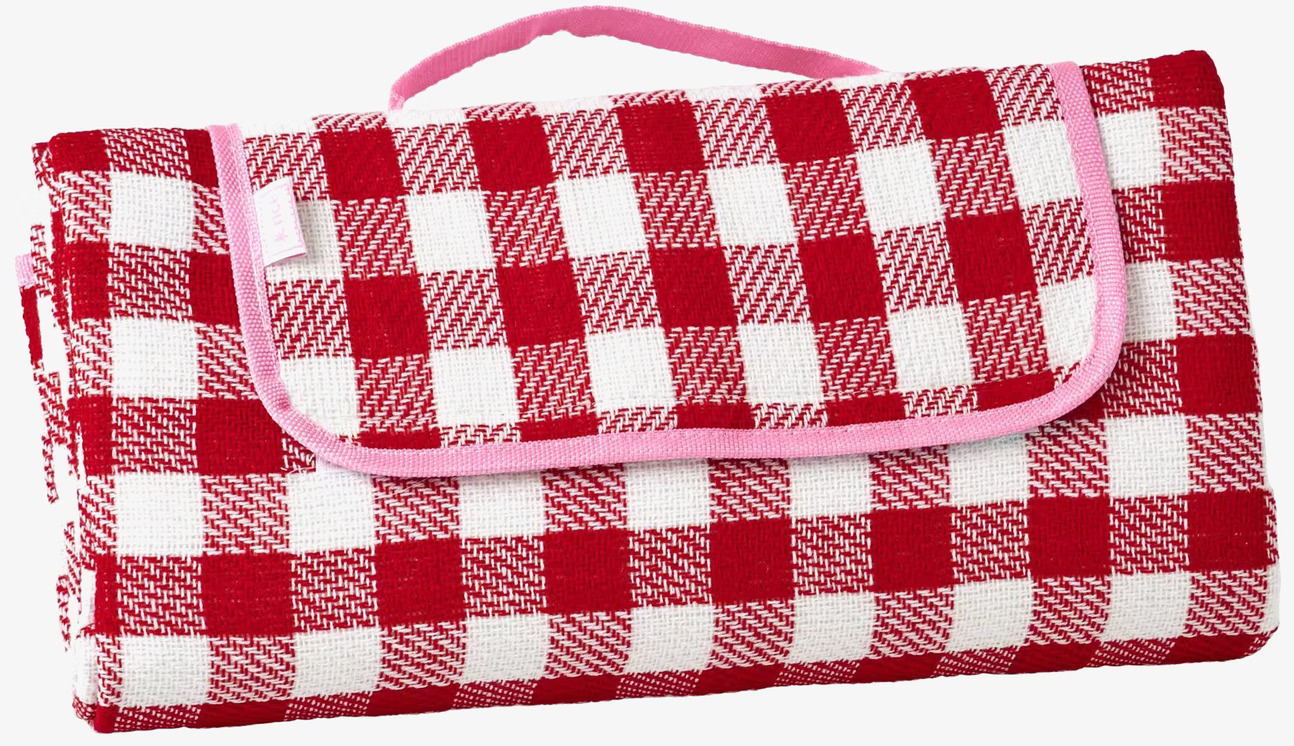 Foto av rutig piknickfilt med bärrem och kantning