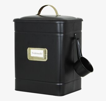 Bild av stilren plåtburk för tvättmedel med mässingsdetaljer