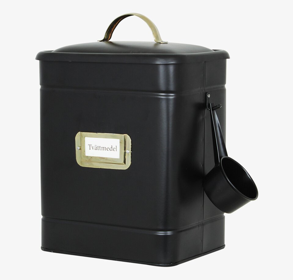 Bild av stilren plåtburk för tvättmedel med mässingsdetaljer